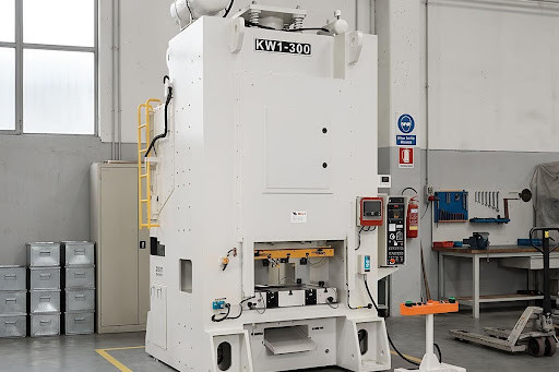 Stamtec KW1-300 forging press, a tall column-frame model with an access ladder, in a manufacturing shop